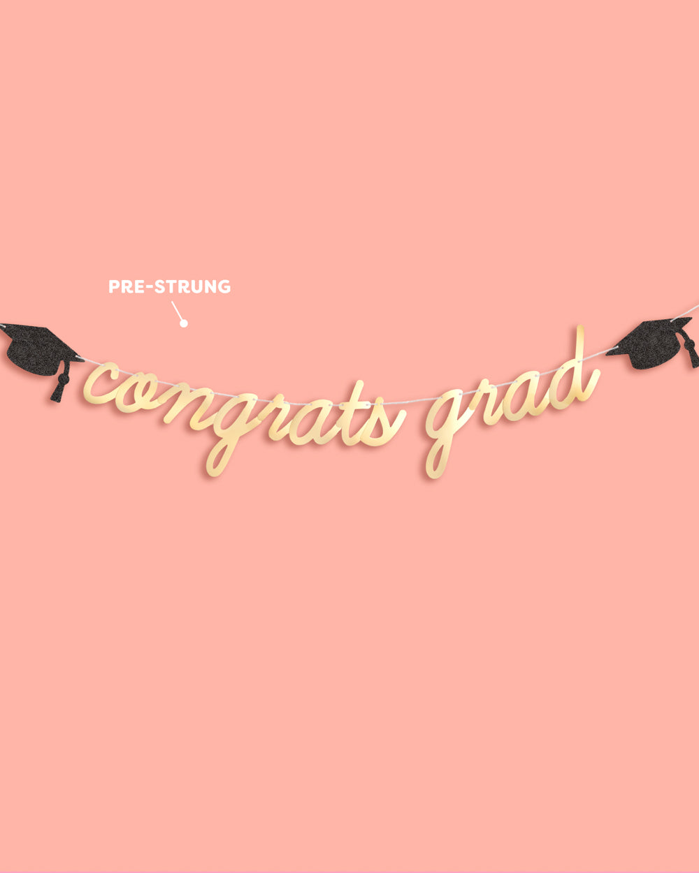 Graduation-themed decorative string with 'congrats grad' on a pink background