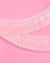 Iridescent tinsel ribbon on a pink background