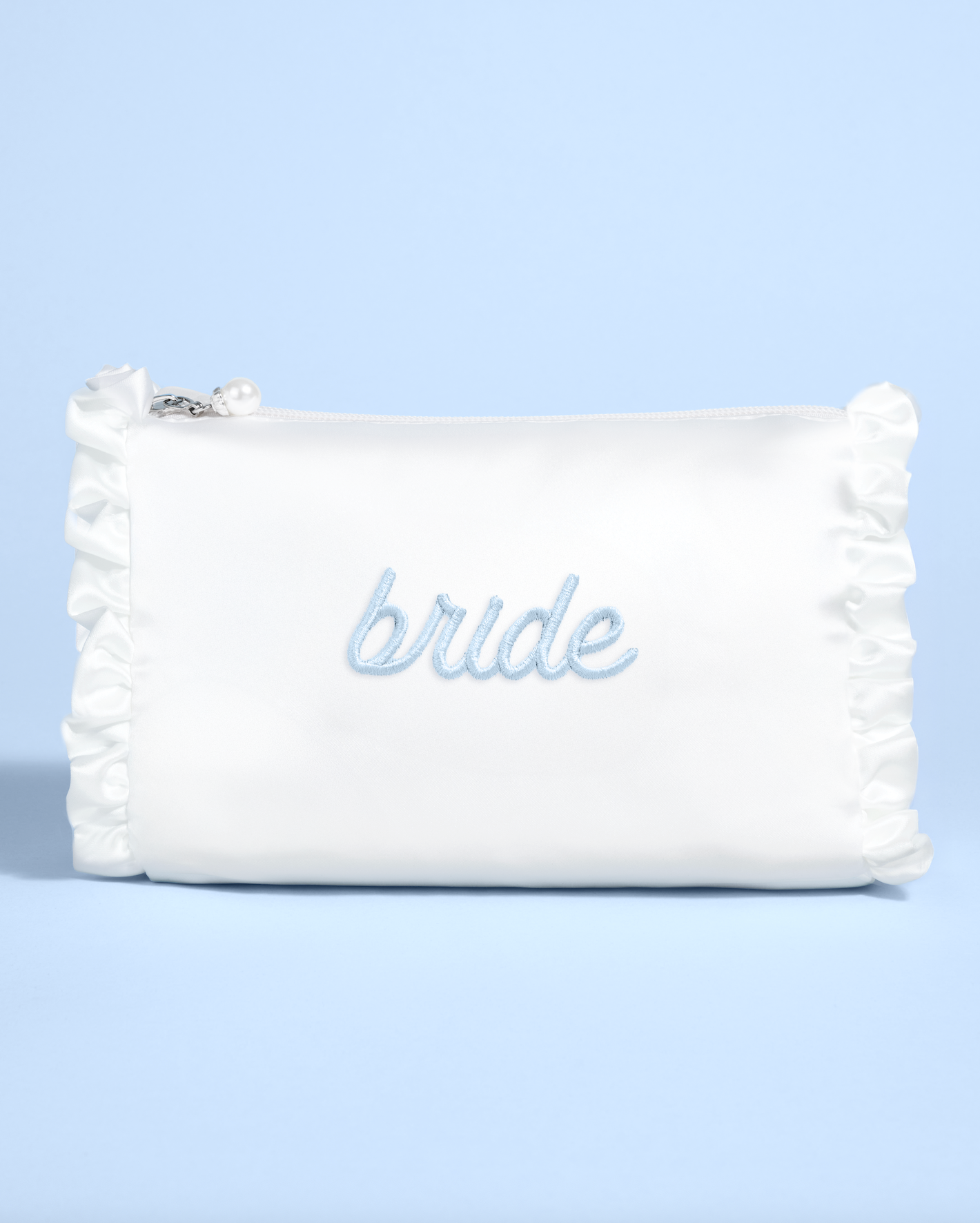 White pouch with 'bride' embroidery on a light blue background