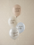 Four balloons with 'Welcome Baby' text on a beige background