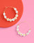 Pearl hoop earrings with 'BRIDE' and 'MOH' on a pink and red background