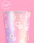 Two colorful cups with ring patterns on a pink and red platform against a pink background