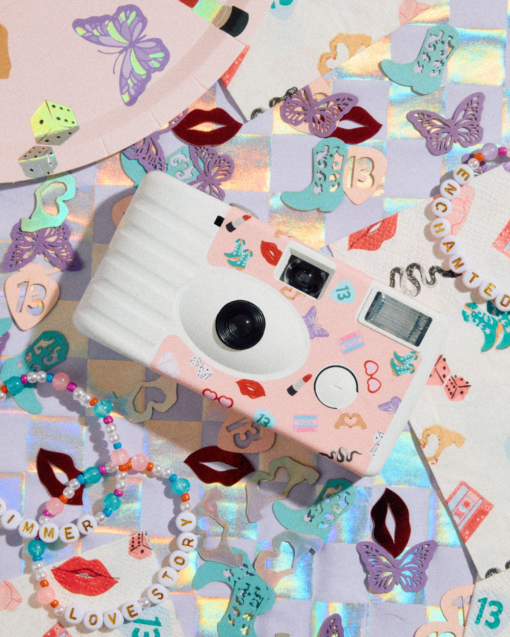 Decorative camera with stickers on a colorful background