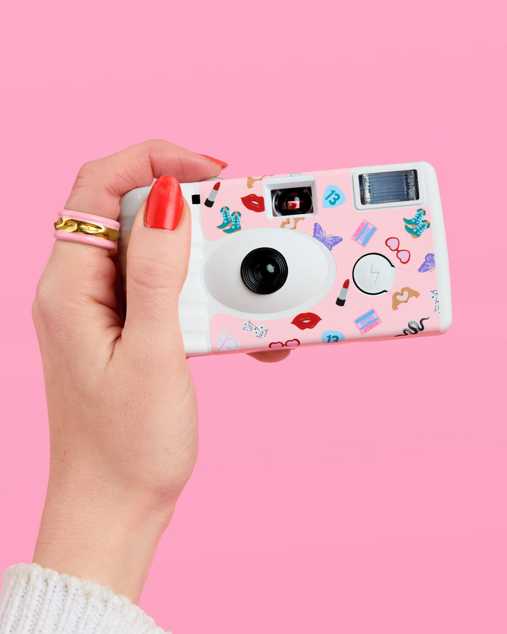 Decorative camera with stickers on a colorful background