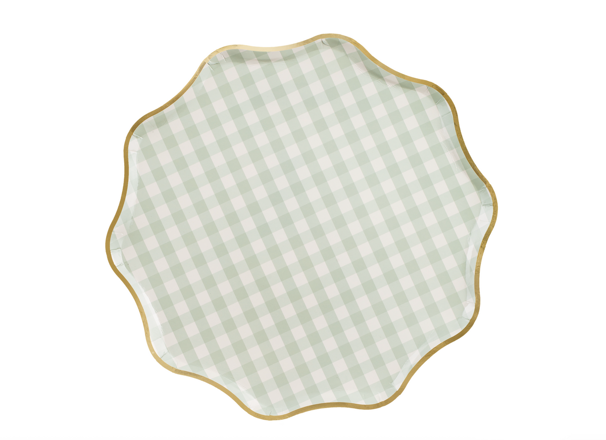 Decorative plate with green and white checkered pattern and gold rim on a white background