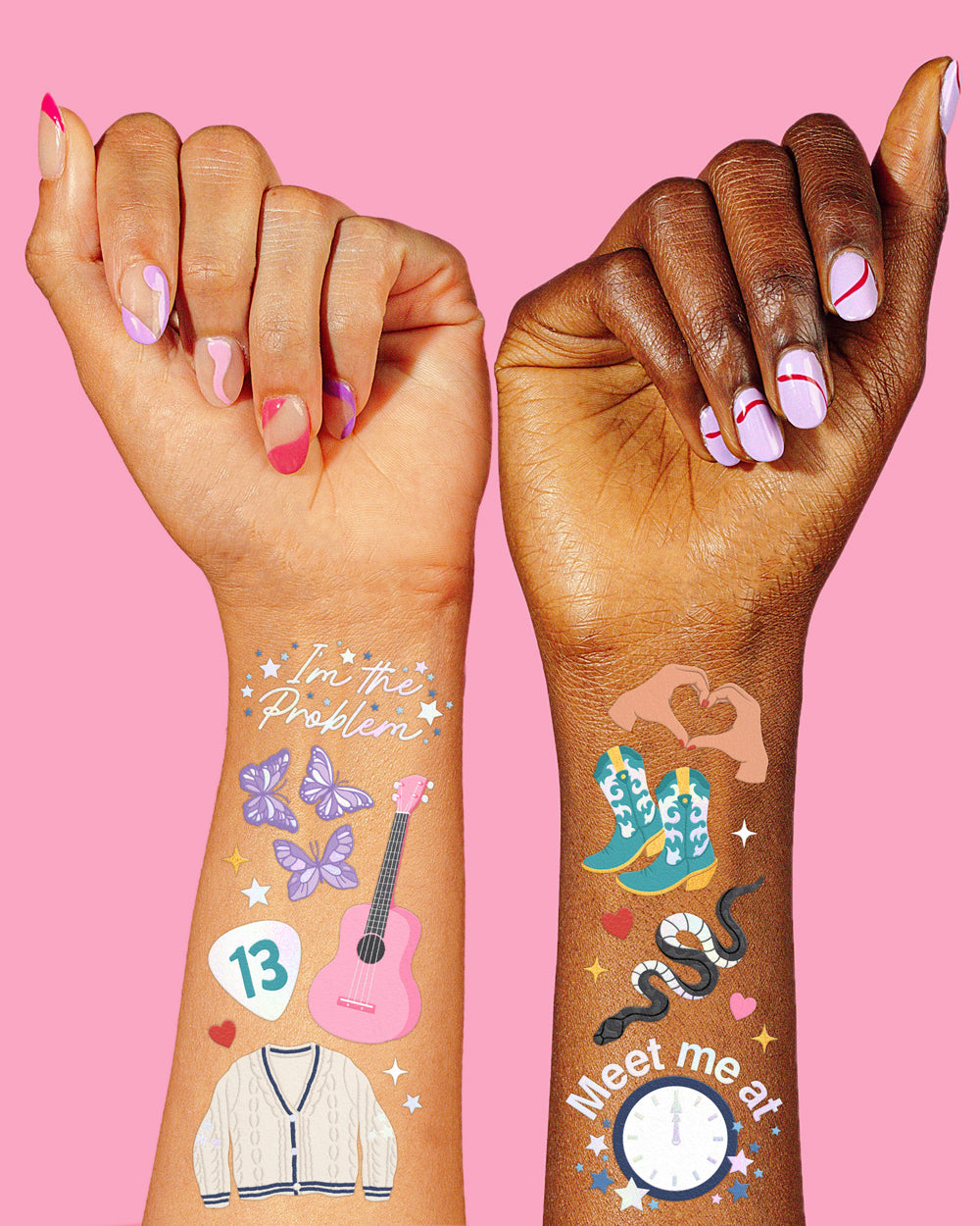 Two hands with colorful temporary tattoos on a pink background