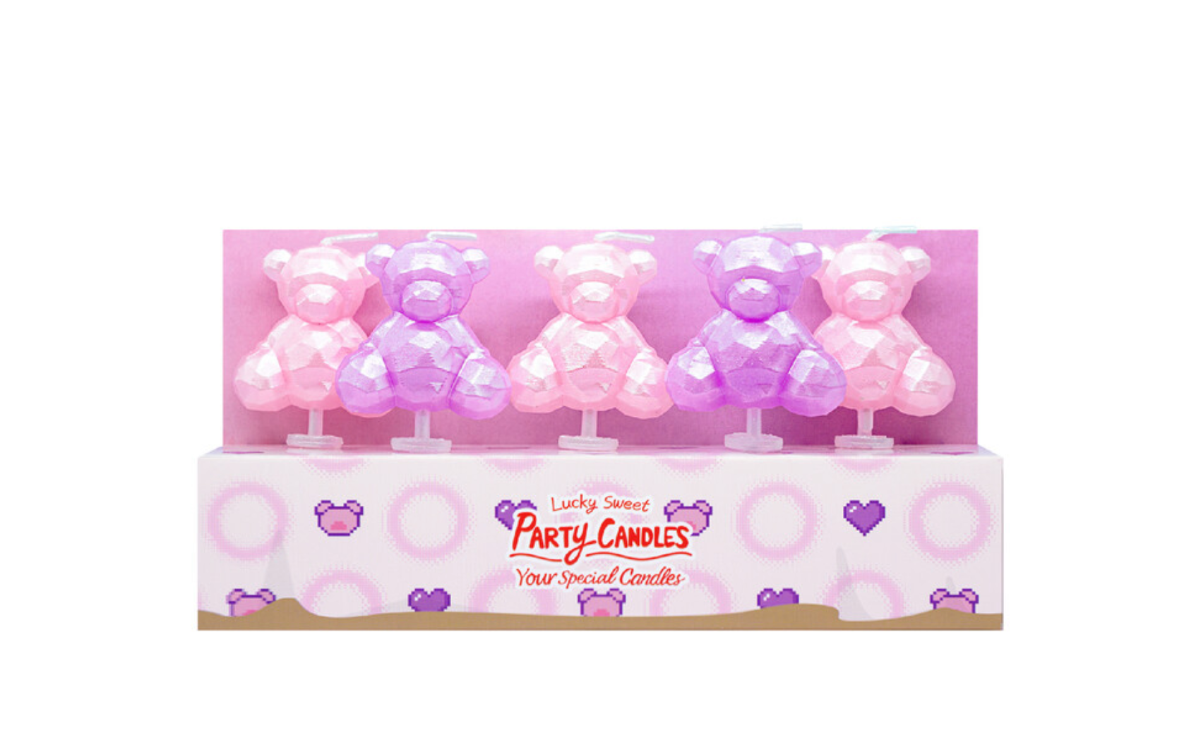 Set of four teddy bear-shaped candles in pink and purple packaging on a white background