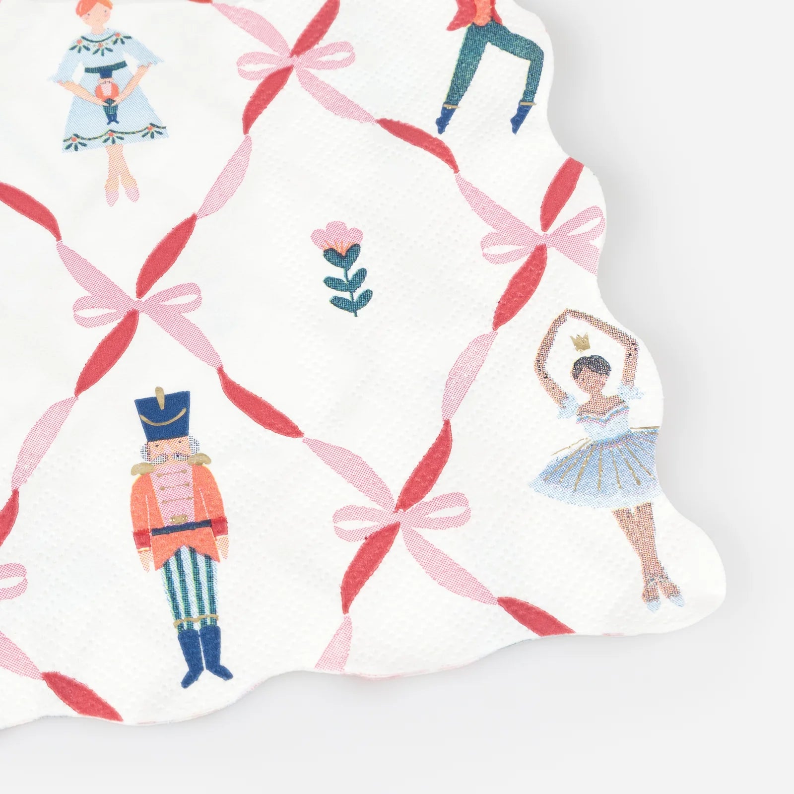 Pattern with ballet dancers, nutcrackers, and pink ribbons on a white background