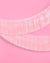 Iridescent tinsel ribbon on a pink background