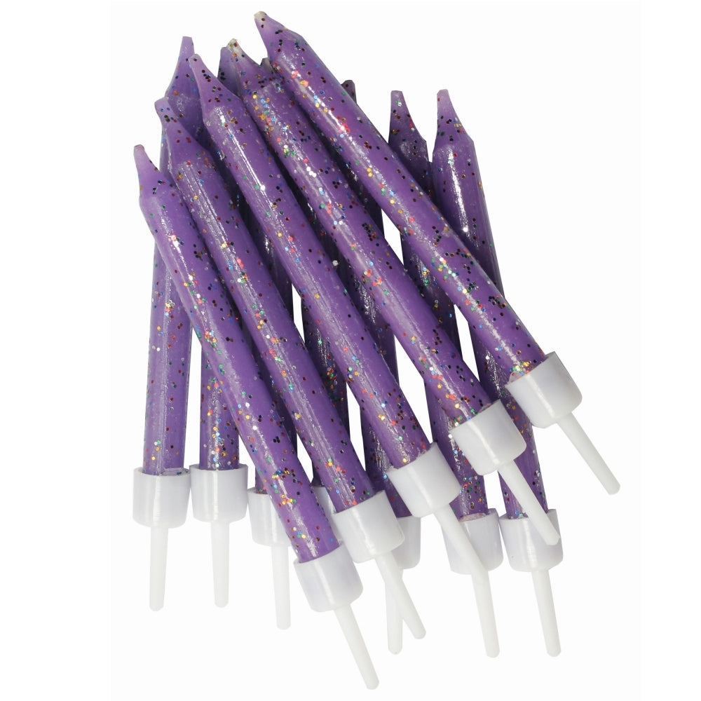 Purple birthday candles with white bases on a white background
