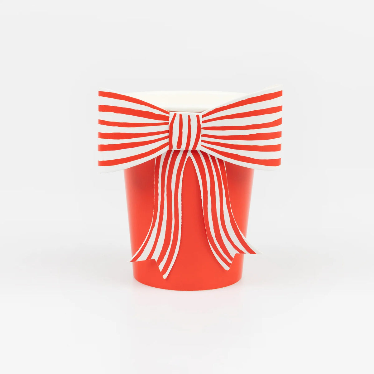 Red cup with a white bow design on a white background