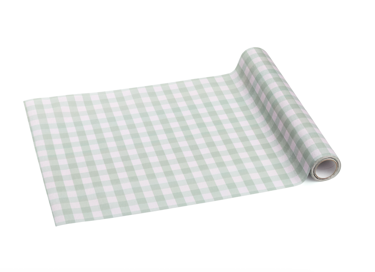 Roll of green and white checkered fabric on a white background