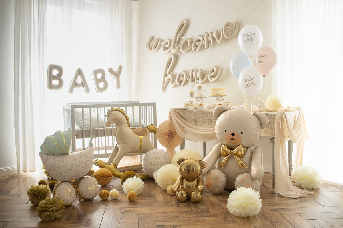 Baby room with teddy bear, rocking horse, and decorative balloons.