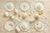 Paper cup with floral design and gold trim on a white background