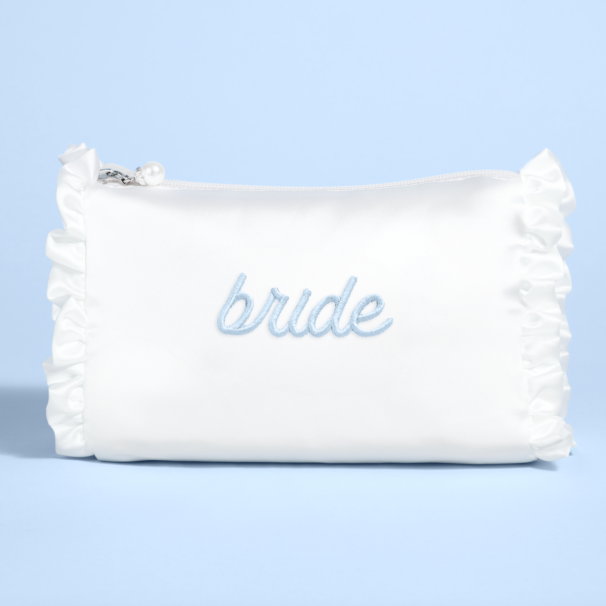 White pouch with &#39;bride&#39; embroidery on a light blue background