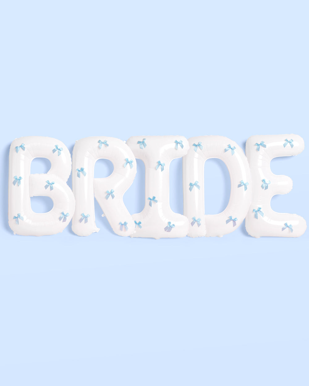 White balloon letters spelling &#39;BRIDE&#39; with blue bow decorations on a light blue background
