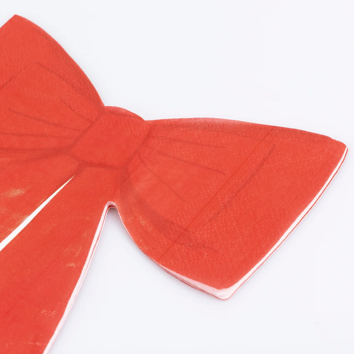 Red bow-shaped object on a white background