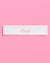 White headband with 'Bride' embroidery on a pink background