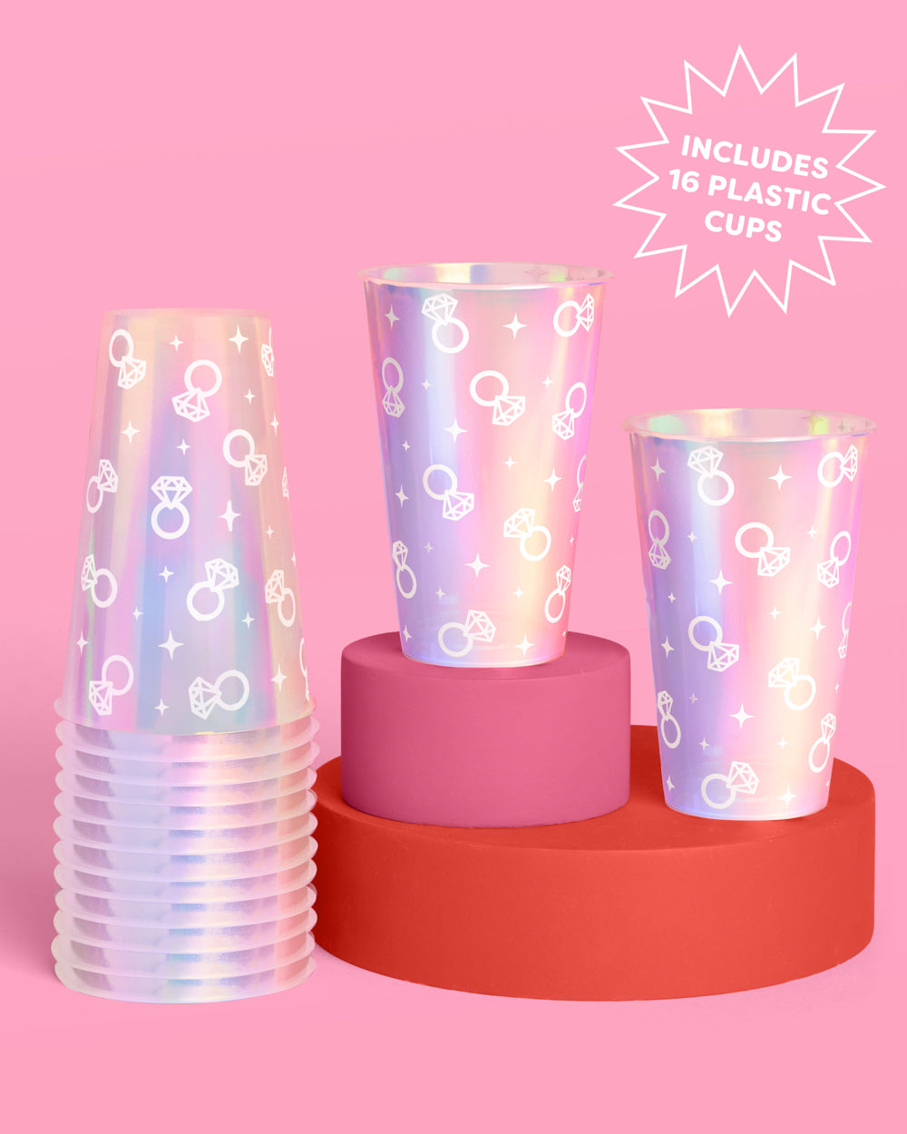 Set of iridescent plastic cups on a pink and red stand with a pink background