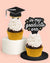 Graduation-themed cupcake toppers with decorative text on a pink background