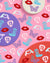 Colorful decorative plates with designs on a pink background