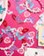 Decorative paper cutouts with numbers and letters on a pink background